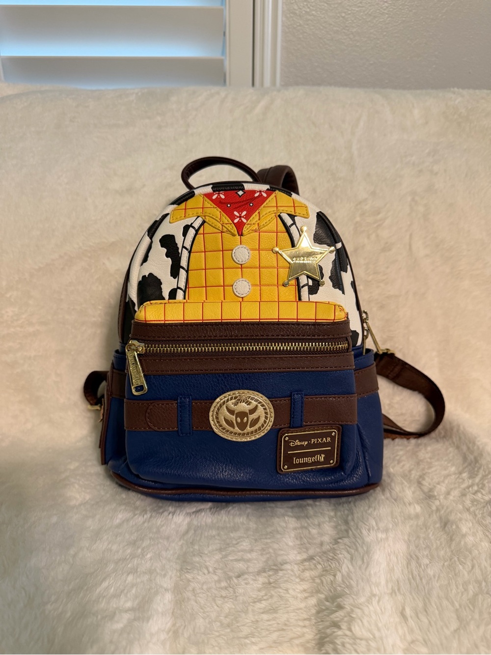 Loungefly Woody-Inspired Mini Backpack in Blue, Brown, Yellow